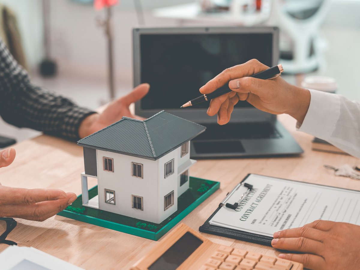 Homeowners reviewing property financing and investment documents